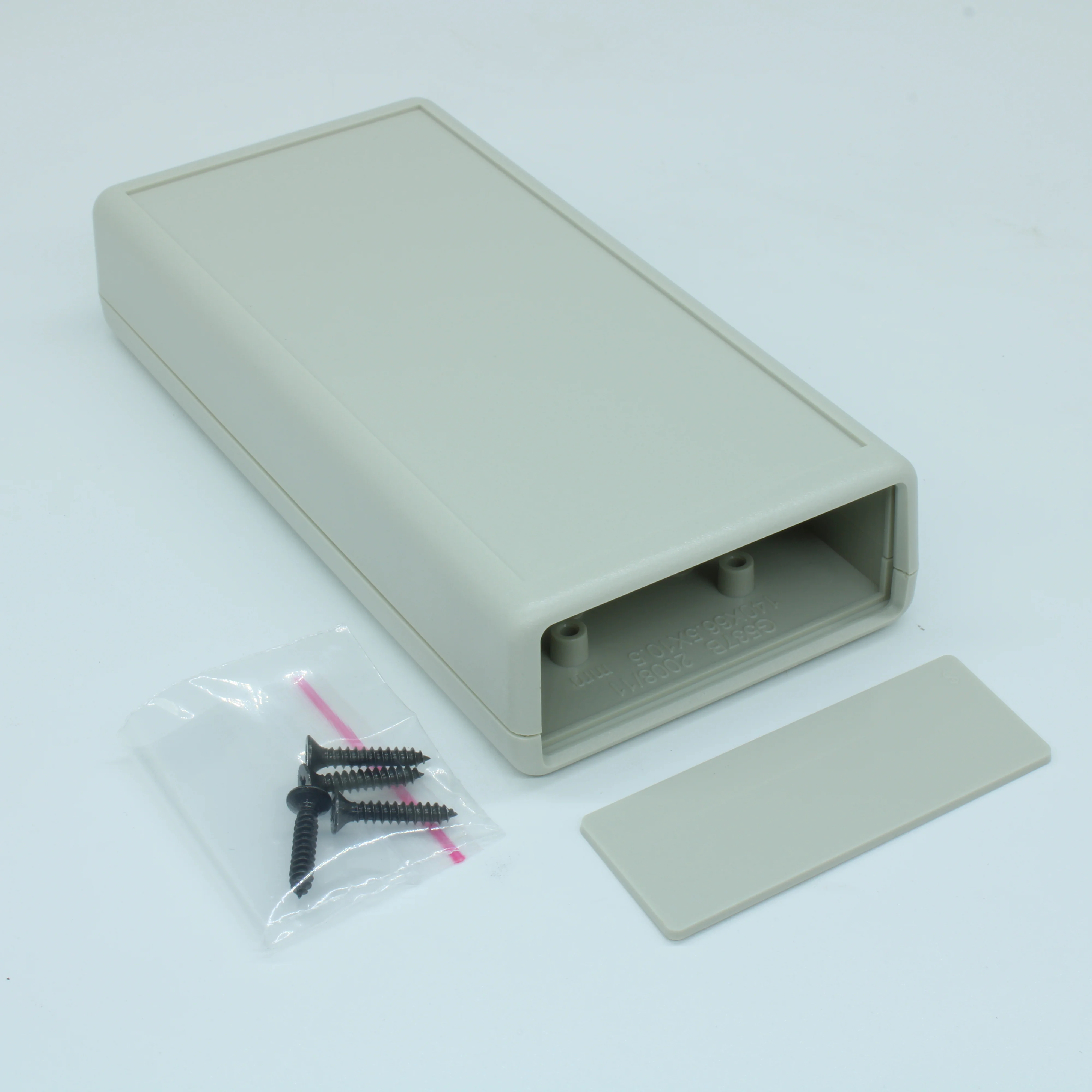 G537G(BC)-1$ - Корпус приборный с батарейным отсеком, носимый, материал: ударопрочный пластик ABS, одна панель "$", серый